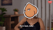 a woman says she 's back baby with a cartoon face in front of her