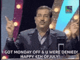 a man in a suit and glasses is giving a speech on a sony television channel .