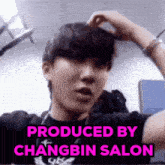 a picture of a young man with the words produced by changbin salon on the bottom