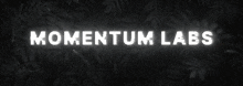 the word momentum is glowing in yellow on a dark background