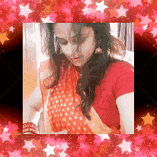 a woman in a red shirt is surrounded by pink stars and hearts