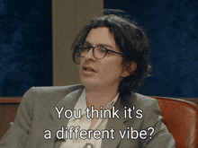 a man with glasses and a suit says you think it 's a different vibe