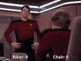 a man in a red shirt is standing in front of a mirror with the words riker 0 and chair 0 below him .