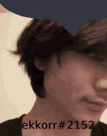 a close up of a person 's face with the words ekkorr # 2152 on the bottom