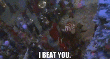 a christmas scene with the words `` i beat you '' written on the bottom .