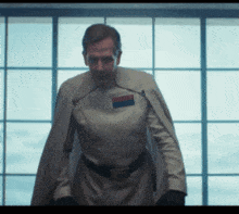 a man in a star wars uniform with a cape