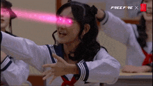 a girl in a school uniform with hearts coming out of her eyes and the words free fire x behind her