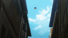 a person is flying through the air between two tall buildings