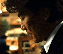 a close up of a man 's face with the letter e visible