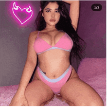 a picture of a woman in pink underwear with a heart in the background