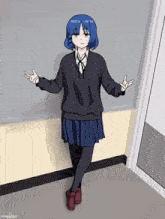 a girl with blue hair is standing in front of a chalkboard