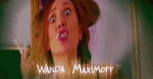 a woman making a funny face with the name wanda maximoff in the corner
