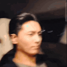 a blurry picture of a man 's face with a few lines visible
