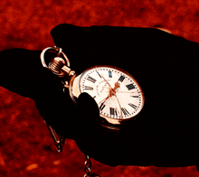 a person is holding a pocket watch that says ' rolex ' on it