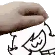 a close up of a person 's hand touching a drawing of a cat .
