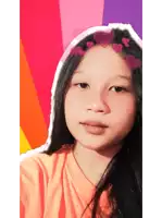 a young girl with hearts in her hair is taking a selfie