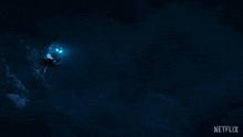 a man in a superhero costume is swimming in the dark with a netflix logo in the corner