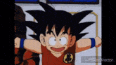 a young goku from dragon ball z is standing in front of a window with his arms outstretched and smiling .