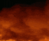 a man with a surprised look on his face is standing in front of a fire
