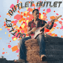 a man is sitting on a bale of hay playing a guitar and the words outlet outlet are visible in the background