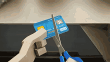 larry needlemeyer credit card cutting up cut sissors