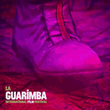 a poster for the guarimba international film festival shows a close up of a man 's eye
