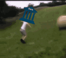 a coin with the letter b on it is being pushed by a blue building with the word bank on it