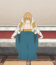 a woman in a blue and yellow dress is kneeling down