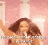 a woman is singing into a microphone with the words passion pain pleasure no shame .