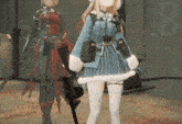 a girl in a blue dress is standing next to another girl in a red dress