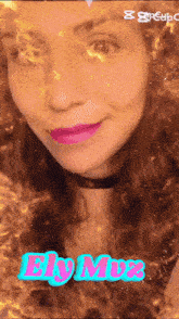a woman 's face is surrounded by flames and the word ely mix is visible