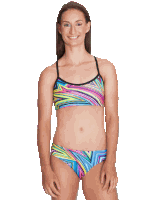 a woman in a colorful bikini is smiling