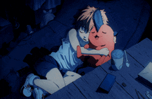 a boy is hugging a stuffed animal that looks like a devil