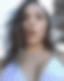 a blurry picture of a woman with long hair