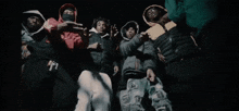 a blurry picture of a group of people in a dark room .