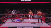 two wrestlers are in a ring with the words ring of honor on the side