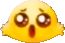 a close up of a yellow smiley face with a surprised face .