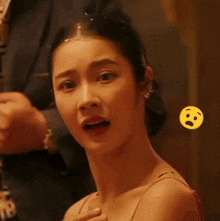 a close up of a woman with a surprised face