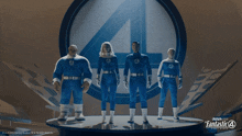 a group of fantastic four figures are standing on a stage