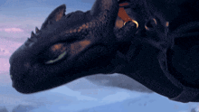 a close up of a toothless dragon flying in the sky