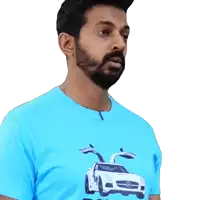 a man with a beard wears a blue shirt with a picture of a mercedes on it