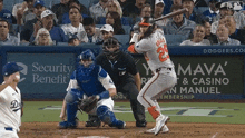 a baseball player with the number 25 on his jersey swings his bat