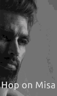a black and white photo of a man with a beard and the words `` hop on misa '' written below him .
