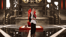 a man stands in front of a throne with a red ribbon around his neck