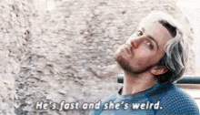 a man in a blue sweater is talking about a woman .