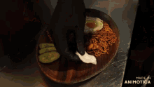 a plate of noodles with a fried egg and cucumbers on a wooden cutting board made in animatica