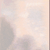 a blurry picture of a person standing in a room
