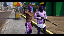 two men wearing purple hoodies and masks holding guns