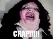 a woman with lipstick on her face is making a funny face with the word crap written on the bottom .