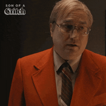 a man wearing glasses and a red suit with the words son of a grifch on the bottom
